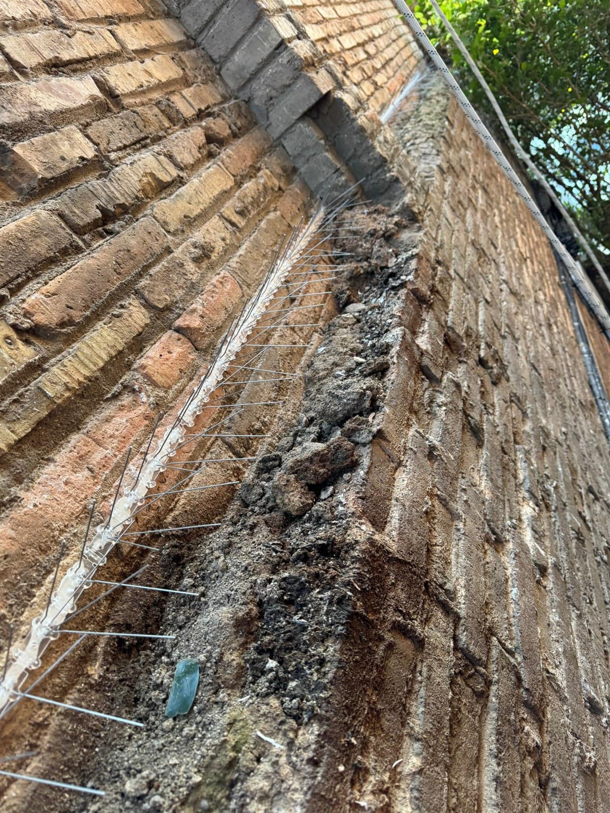 Actual close-up of a deteriorated facade at risk of collapse in Barcelona